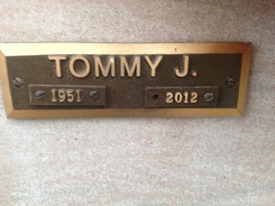 Bronze plaque installed at gravesite